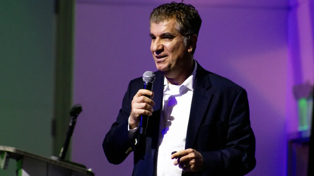 Dr. Kazemi speaking at Reach Out 2026