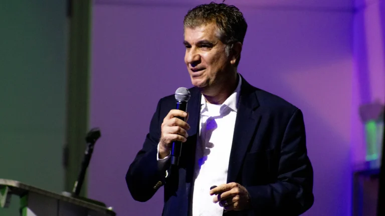 Dr. Kazemi speaking at Reach Out 2026