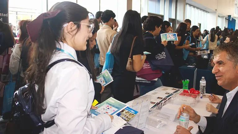 Dr. Kazemi talking with students